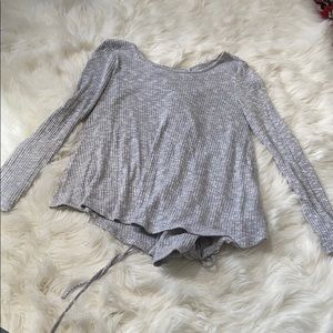 Grey sweater top with tie detail on the back
